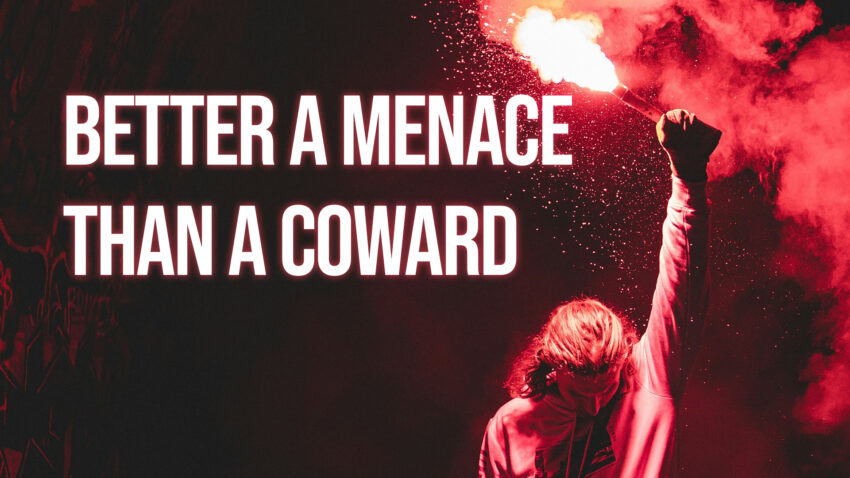 A person in a dark tunnel raises a red flare high above their head, casting dramatic light and smoke around them. Bold white text on the left reads: “Better a Menace Than a Coward.”